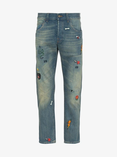 Shop Gucci Tapered Denim Pant With Symbols In Blue