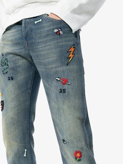 Shop Gucci Tapered Denim Pant With Symbols In Blue