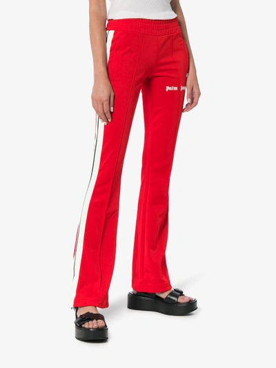 Shop Palm Angels Side Stripe Logo Print Track Pants In Red