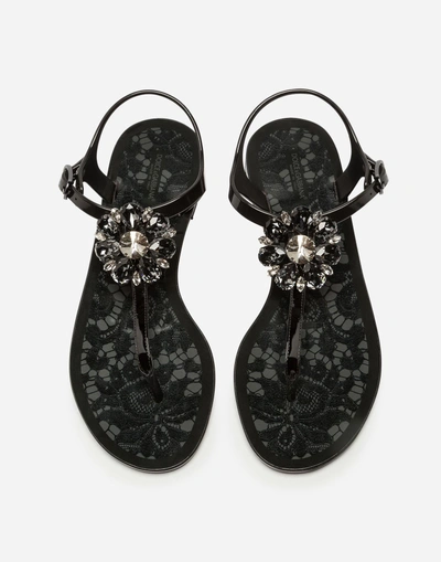 Shop Dolce & Gabbana Rubber And Patent Leather Thong Sandals With Brooch Detail In Black