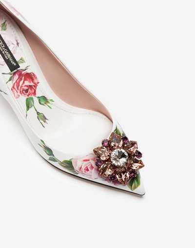 Shop Dolce & Gabbana Printed Patent Leather Pumps With Brooch Detail In Cream