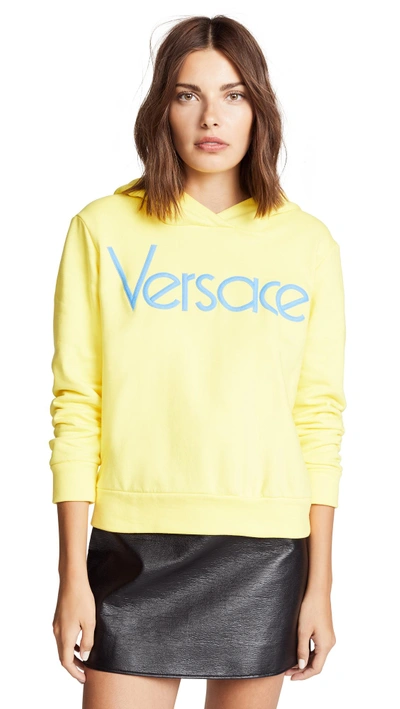 Shop Versace Hoodie In Yellow