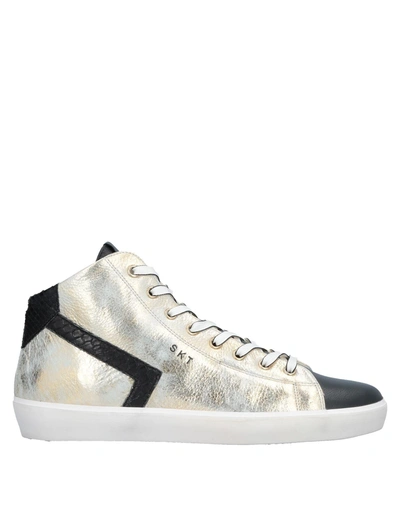 Shop Leather Crown Sneakers In Gold