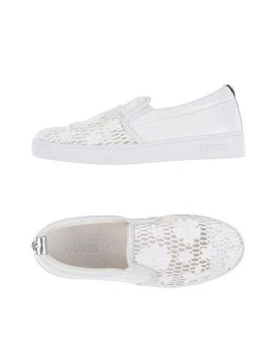 Shop Guess Sneakers In White