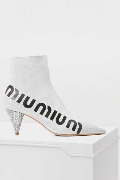Shop Miu Miu Logo Ankle Boots In White/black