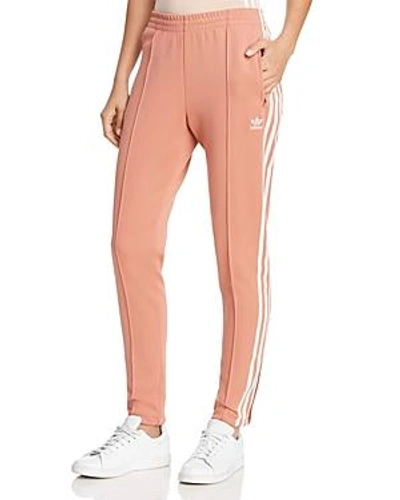Shop Adidas Originals Slouchy Track Pants In Ash Pink
