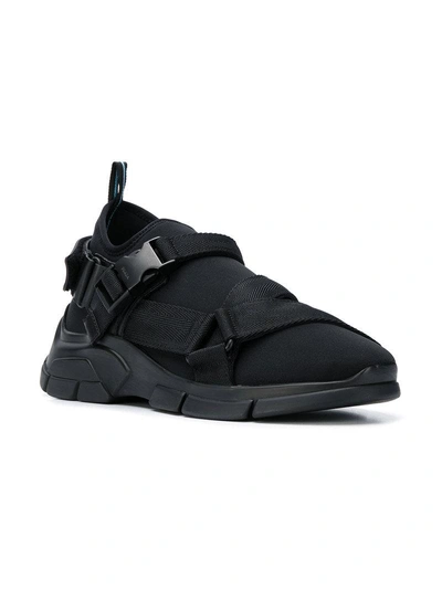 Shop Prada Buckled Sock Sneakers - Black