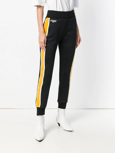 Shop Fendi Side Striped Trousers In Black