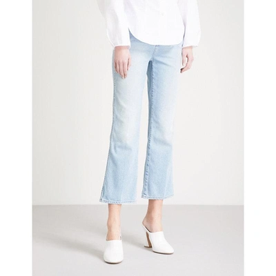 Shop Khaite Benny Cropped Flared Mid-rise Jeans In Austin