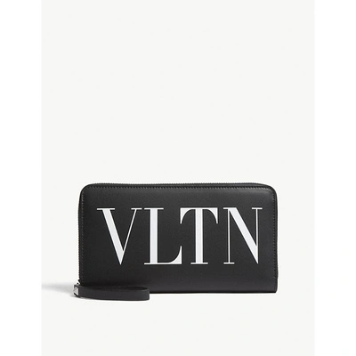 Shop Valentino Logo Zip-around Leather Wallet In Black White