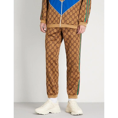 Shop Gucci Gg-intarsia Jersey Jogging Bottoms In Camel Brown