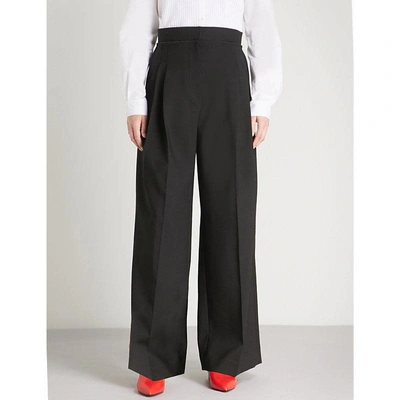 Shop Jw Anderson High-rise Wide Stretch-wool Trousers In Black