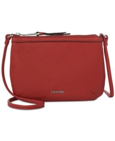 Shop Calvin Klein Carrie Pebble Leather Crossbody In Persimmon/silver