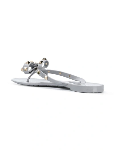 Shop Valentino Rockstud Bow Flip-flops - Grey