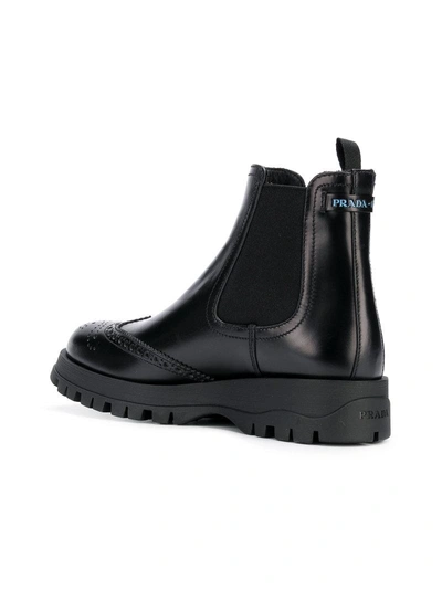 Shop Prada Punch Hole Slip-on Boots - Black