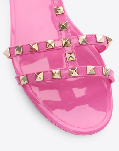 Shop Valentino Rockstud Flat Rubber Sandals In Poudre