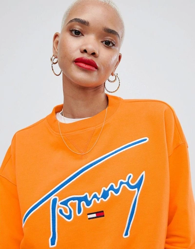 Shop Tommy Jeans Signature Sweatshirt - Orange