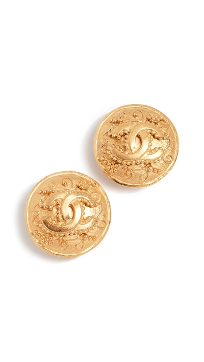 Shop Chanel Grapevine Round Cc Earrings In Yellow Gold