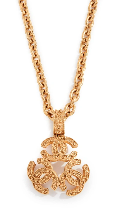 Shop Chanel Gold Triple Cc Necklace In Yellow Gold