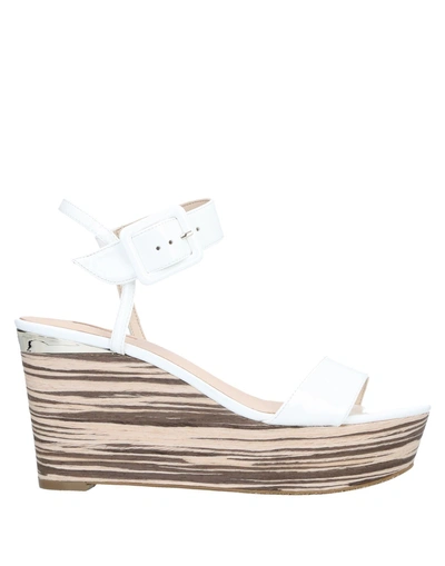 Shop Guess Sandals In White