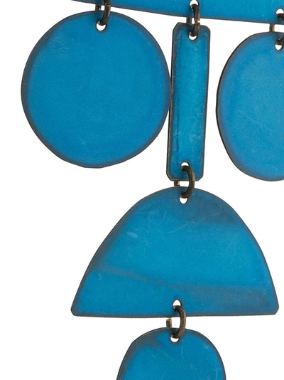 Shop Annie Costello Brown Pom Pom Long Chandelier Earrings - Blue