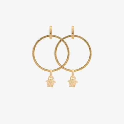 Shop Versace Gold Metallic Medusa Hoop Earrings