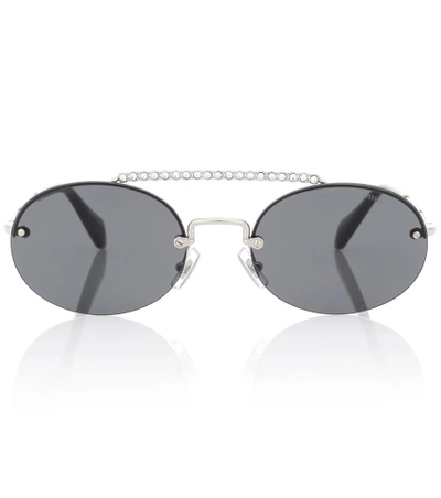 Shop Miu Miu Oval Sunglasses In Black