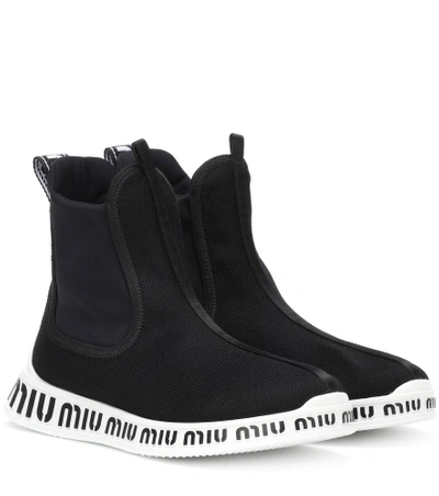 Shop Miu Miu Logo Ankle Boots In Black