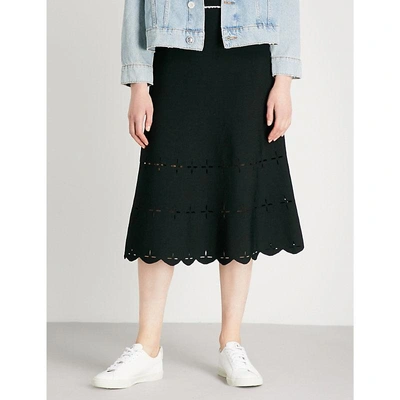 Shop Sandro Laser-cut Stretch-knit Midi Skirt In Black