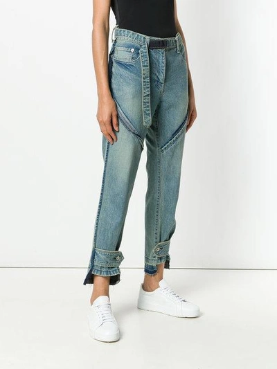 Shop Sacai Buckle Cropped Jeans In Blue