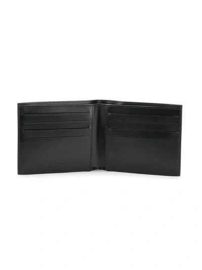 Shop Givenchy Star Logo Bi-fold Wallet In Black