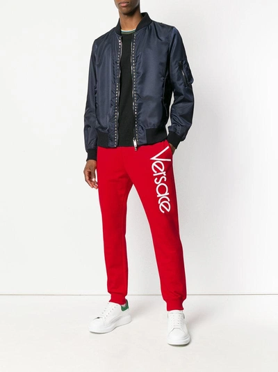 Shop Versace Logo Print Track Pants - Red