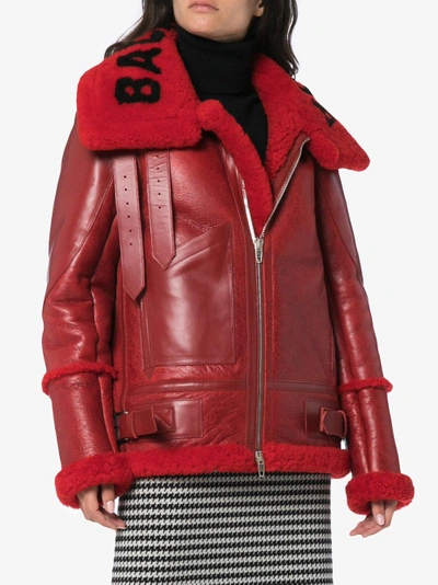 Shop Balenciaga Bombardier Oversized Leather And Shearling Coat In Red