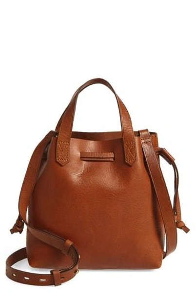 Shop Madewell The Mini Pocket Transport Leather Drawstring Tote - Brown In English Saddle