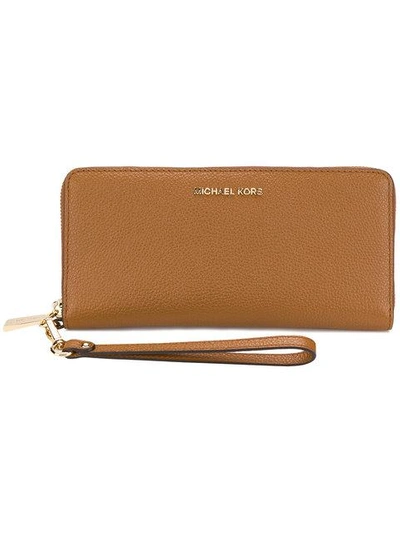 Shop Michael Kors Continental Purse In Brown