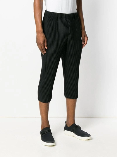 Shop Issey Miyake Homme Plissé  Cropped Pleated Trousers - Black