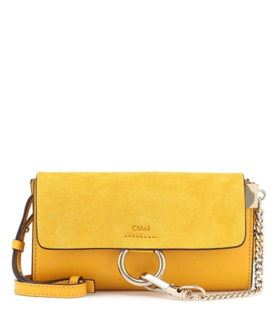 Shop Chloé Faye Mini Leather Wallet Bag In Yellow
