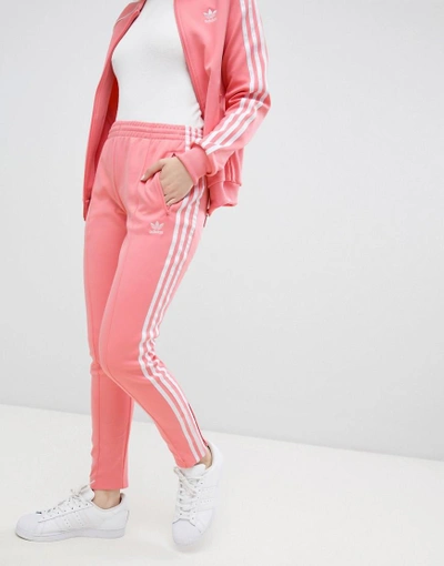 Shop Adidas Originals Three Stripe Cigarette Pants In Pink
