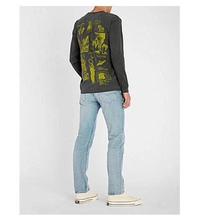Shop Stussy Text Print Cotton-jersey Long-sleeved Top In Black Yellow