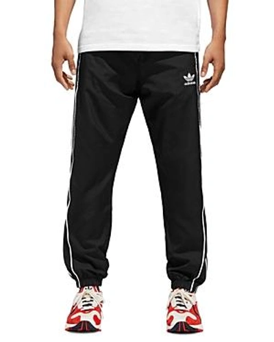 Shop Adidas Originals Windbreaker Pants In Black/white