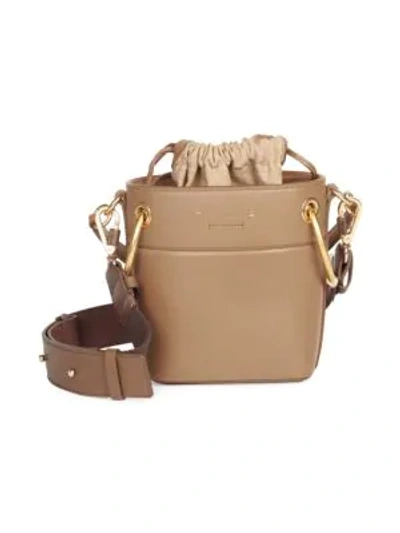 Shop Chloé Mini Drawstring Leather Bucket Bag In Beige