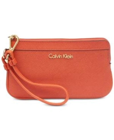 Shop Calvin Klein Saffiano Leather Wristlet In Burnt Orange/gold