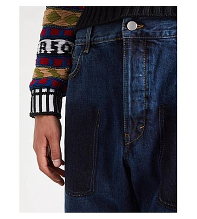 Shop Jw Anderson Multi-pocket Wide-fit Straight Jeans In Indigo