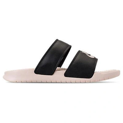 Shop Nike Women's Benassi Duo Ultra Slide Sandals, Black