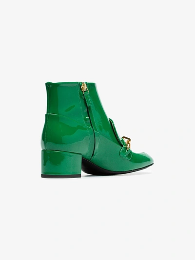 Shop Burberry Link Detail Patent Leather Ankle Boots In Green