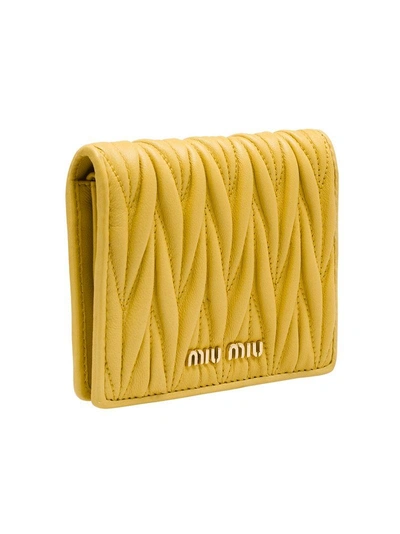 Shop Miu Miu Matelassé Flap Wallet In Yellow
