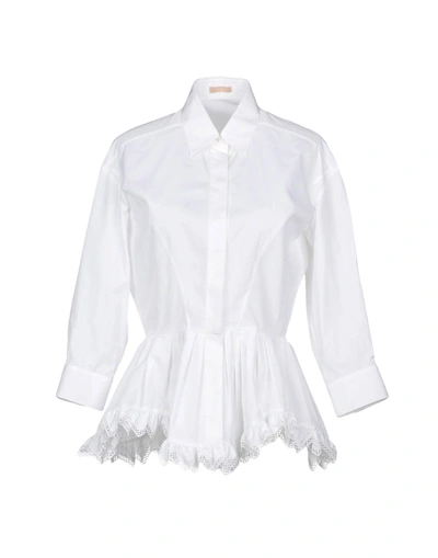 Shop Alaïa Solid Color Shirts & Blouses In White