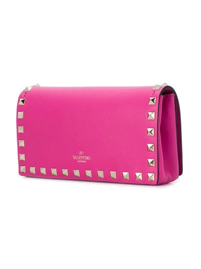 Shop Valentino Garavani Rockstud Crossbody Bag - Pink