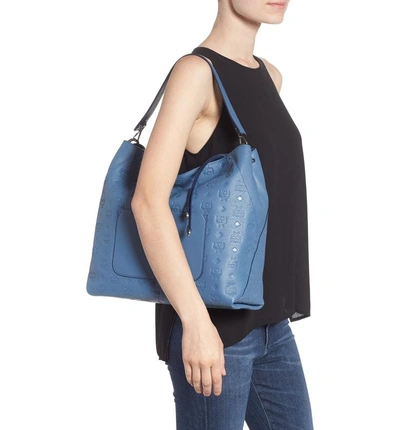 Shop Mcm Klara Monogrammed Leather Hobo Bag - Blue In Luft Blue