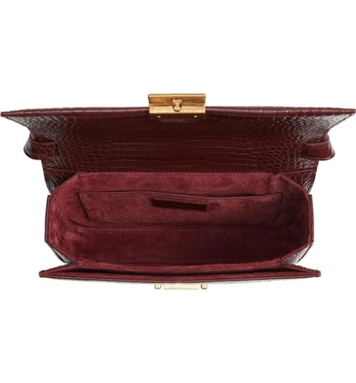 Shop Saint Laurent Medium Bellechasse Croc Embossed Leather Shoulder Bag - Burgundy In Rouge Legion